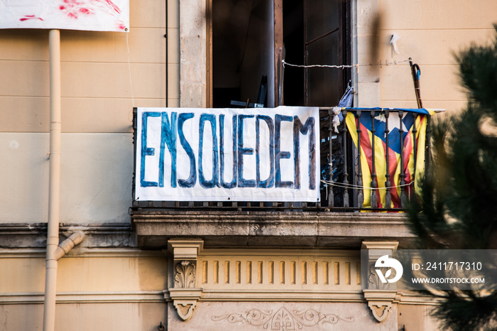 Residential building is occupied by unauthorized squatters and transformed into illegal squat. Anarchist hand-written banner from the window.