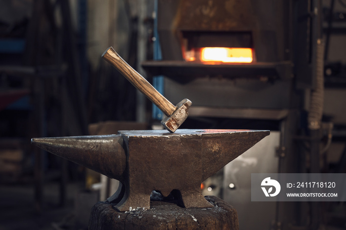 Mallet on an anvil in front of a furnace