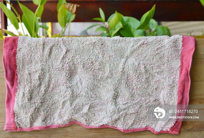 dry old towel in air on wooden board