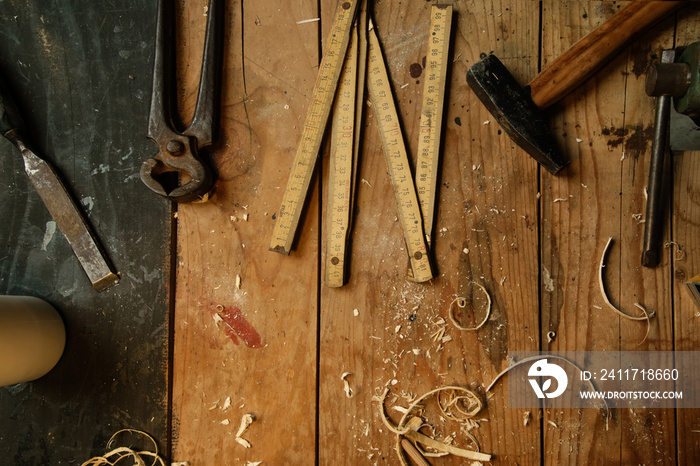 Top view at the wooden table with carpentery tools in workshop