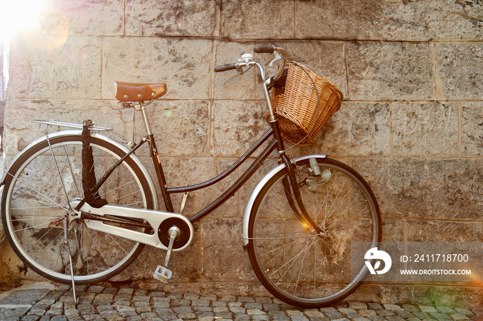 Retro bicycle in empty street - alley.