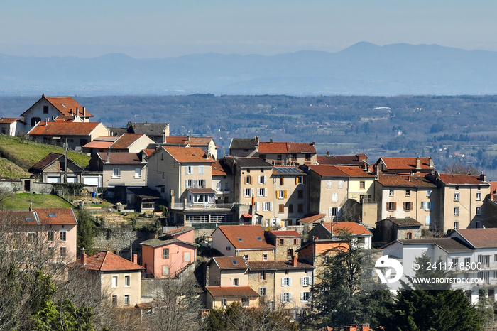 Aerial view of dense historic center of Thiers town in Puy-de-Dome department, Auvergne-Rhone-Alpes region in France. Rooftops of old buildings and narrow streets