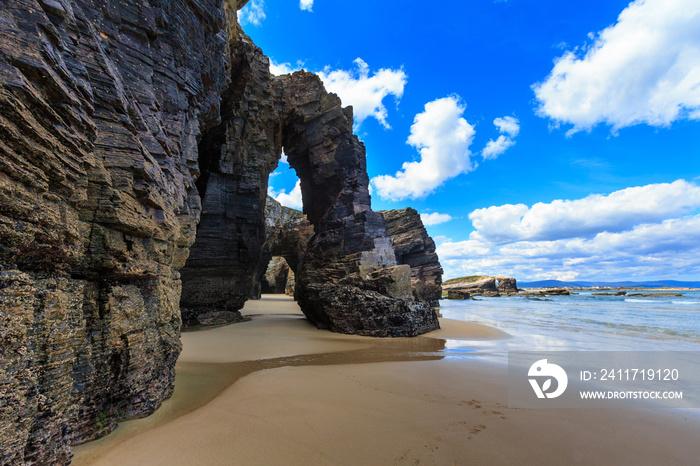 Natural arches on beach.