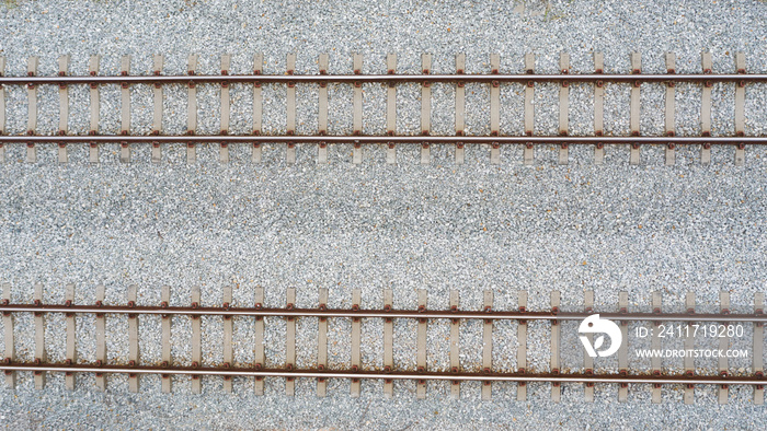 Top view of railroad tracks and abstract background