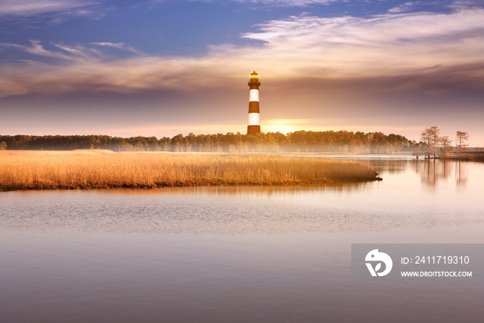 The lighthouse with marshlands and the lake background in Outerbanks NC, USA. Soft blurry background.