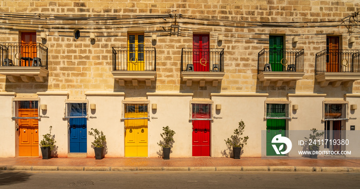 colorful doors of a building at the harbor of marsaxlokk on malta