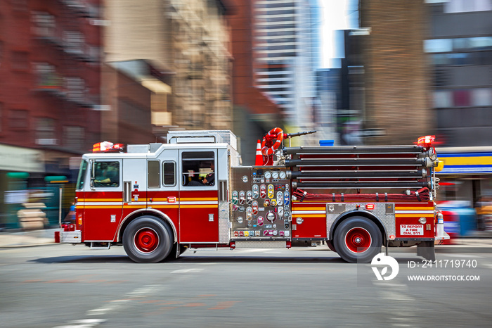 fire trucks and firefighters brigade in the city