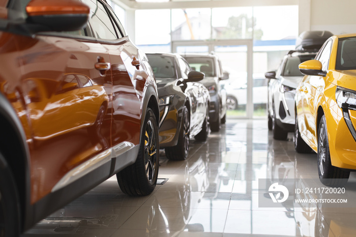 Closeup of brand new luxury cars in vip showroom