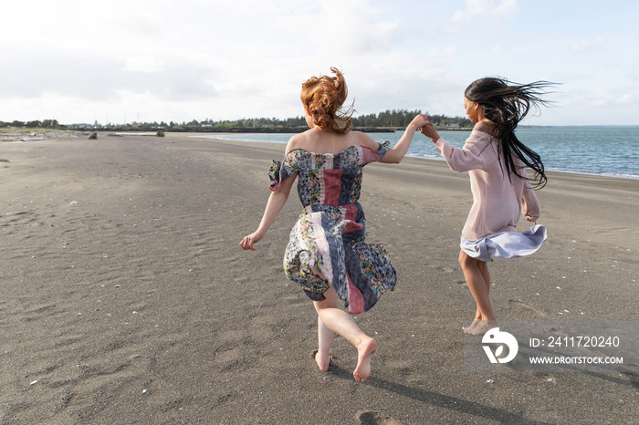 Two pretty women together at beach