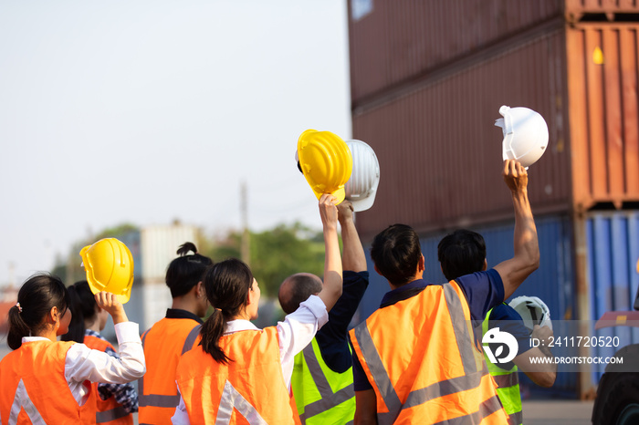 Strike of workers in container yard. Group of multiethnic engineer people during a protest in workplace