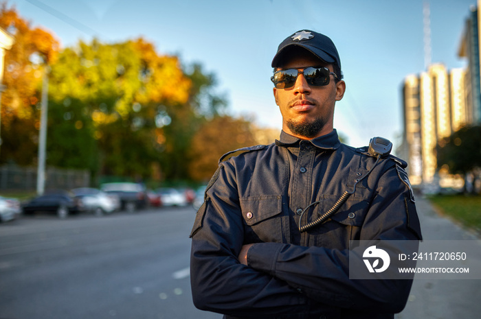 Police officer in uniform and sunglasses outdoors