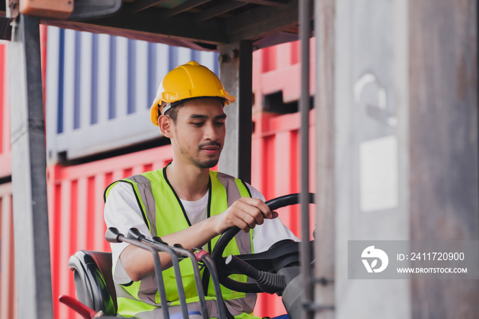 Young Asian work man driving the truck over construction site. Industrial factory worker operating on forklift in the import export shipyard. Foreman at warehouse logistic in Cargo freight ship.