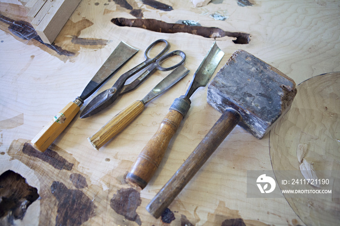 High angle view of work tools on table in workshop