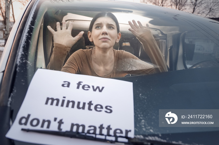 Young woman locked in car. Concept of cruelty to animals