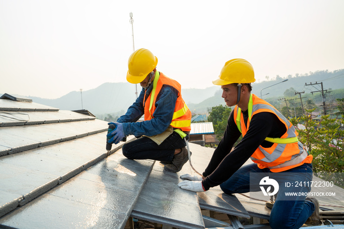 Professional technician roof install new roof on the roof top,Roofing tools,Hold the drive screw tool in hand.