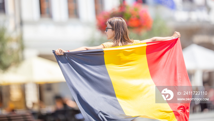 Attractive happy young girl with the Belgian flag