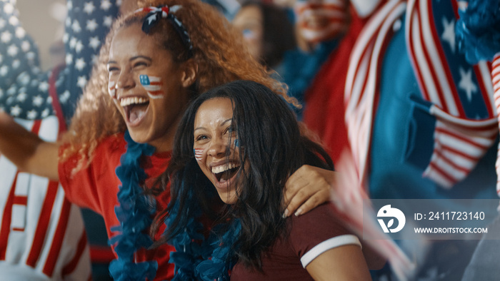 Group of American soccer fans cheering in fan zone