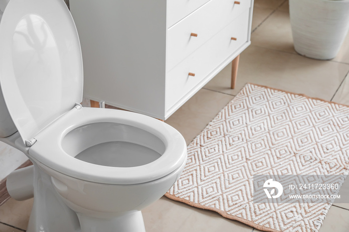 Modern toilet bowl in interior of restroom