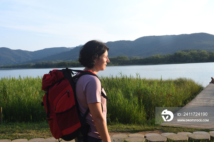 Hiker woman looks at the landscape