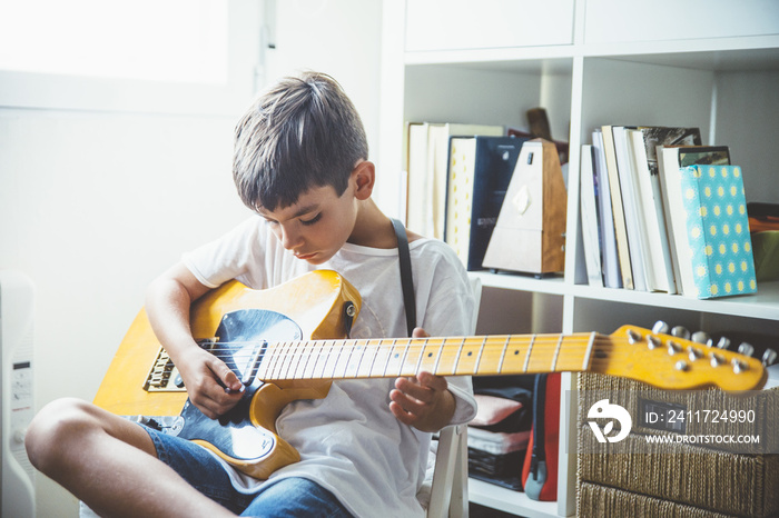 Young boy with guitar