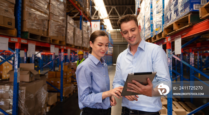 Warehouse manager talking and using digital tablet while checking product in warehouse, Logistic industry concept.