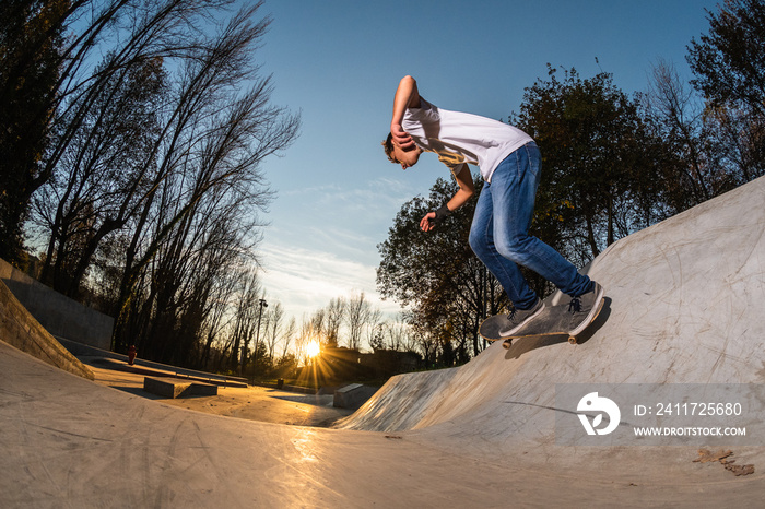 Skateboarder on wall turn