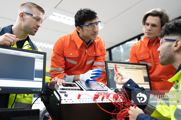 Two Caucasian engineer man learning with electric and computer programming in class