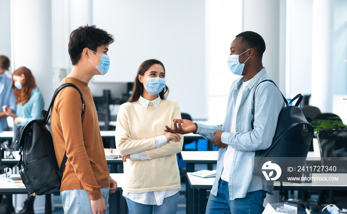 International students wearing medical masks and talking