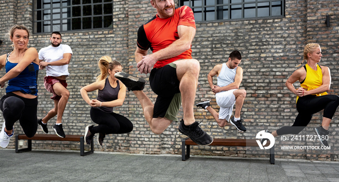 Group of people training fitness and martial arts together