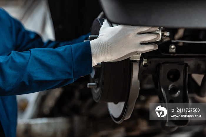 cropped view of mechanic installing brake pad on disk brakes