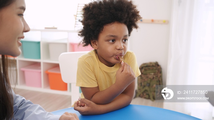 Preschool teacher with children study in classroom. Kindergarten back to school and summer course.