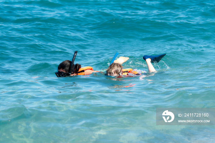 Mother and Young Son Snorkeling with Life Jackets in the Ocean at Punta Mita, Nayarit, Mexico