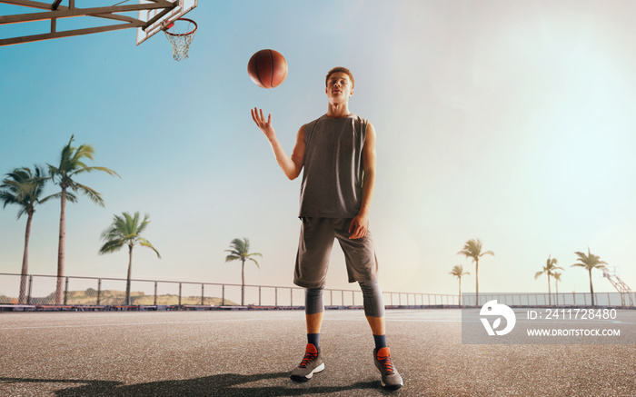 Streetball. Basketball player in action on sunset.