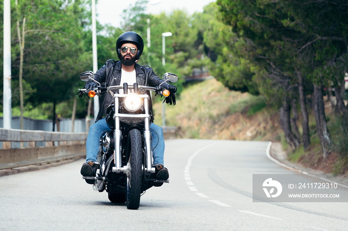 biker driving his motorcycle on the road