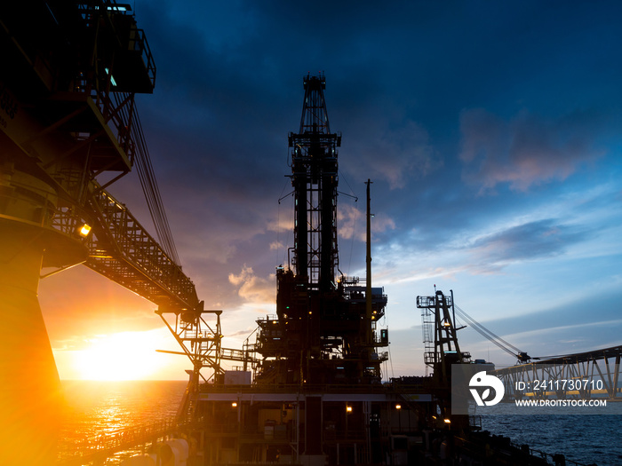 Derrick of Tender Assited Drilling Oil Rig (Barge Oil Rig) on The Production Platform During Sunrise