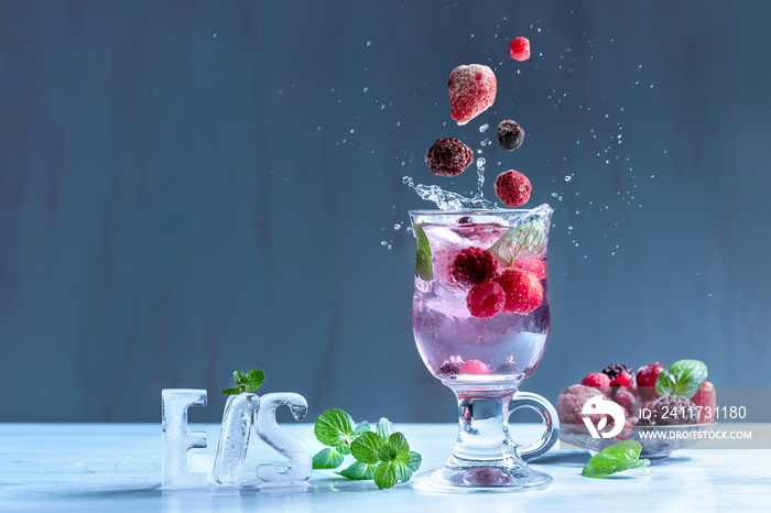 Wild berry cocktail with splashes of water