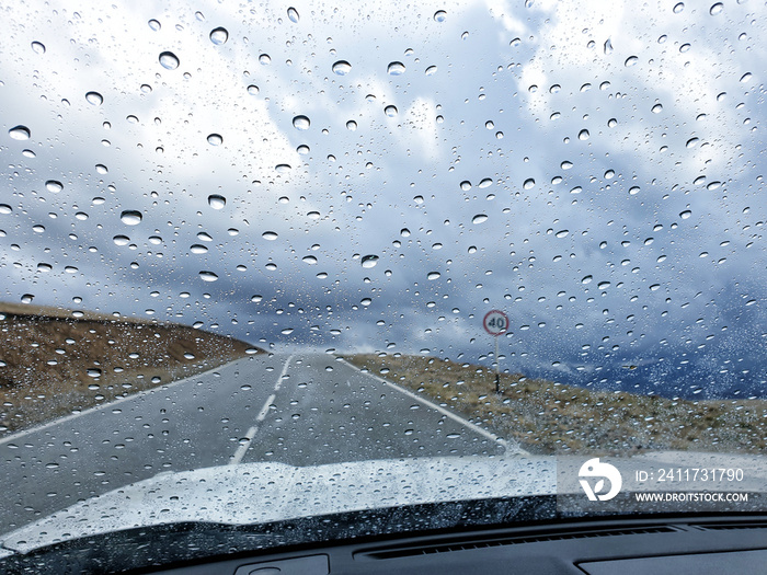 rain drops on windshield of car