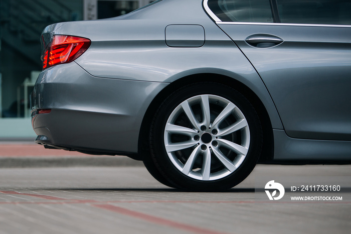 Modern sedan car rear wheel and rim