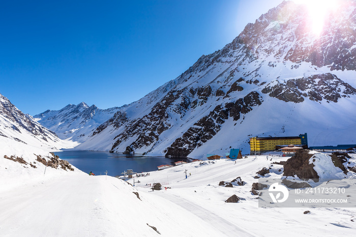 ski in chile on a sunny day with lots of snow.