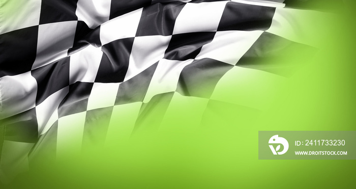 Checkered black and white flag on green background