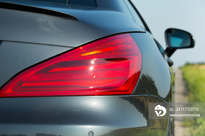 Photos of the Mercedes Benz SL550 convertible on the road. Rear brake light view.