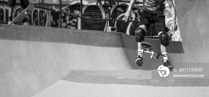 Skateboarder practicing in the skate park.