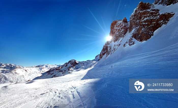 Bright Sunshine Blasting from Mountain Peak in French Alps