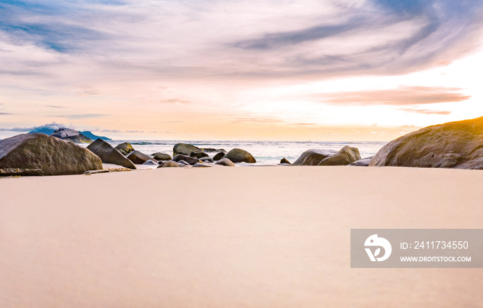 Tropical beach with white sand and rocks, copyspace for text. tropical summer holidays concept