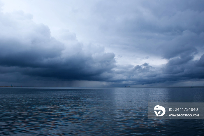 Dramatic storm clouds over the sea. Baltic Sea. Seascape in front of a storm.