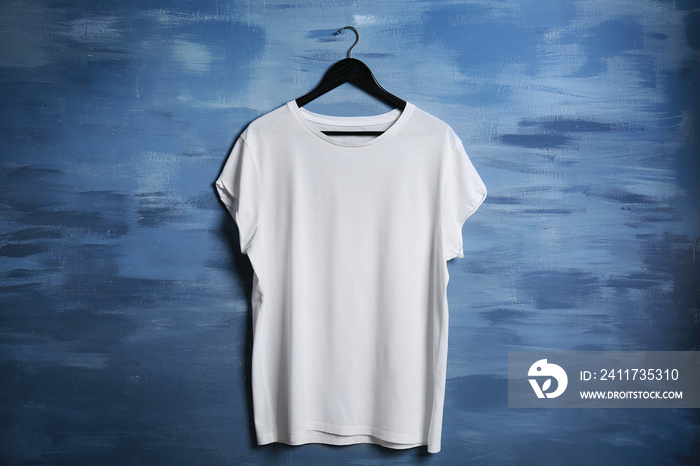 Blank white t-shirt against grunge background