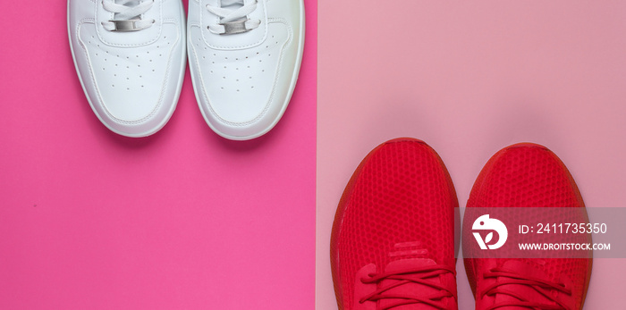 Two pairs of sneakers on pastel color background. White and red shoes. Top view