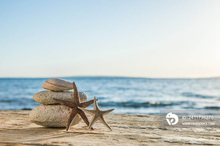 Blue Sea on Background Selective focus, zen stones on sea beach, meditation, spa, harmony, calm, balance concept