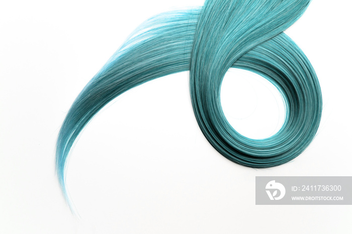 Piece of beautiful, shiny blue, cyan hair on white isolated background.