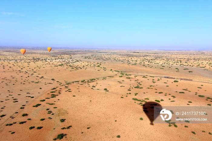 shadow of Hot air balloon  on marrakesh desert